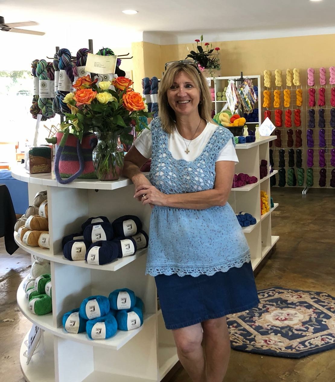 Helen standing She Sells Yarn shop
